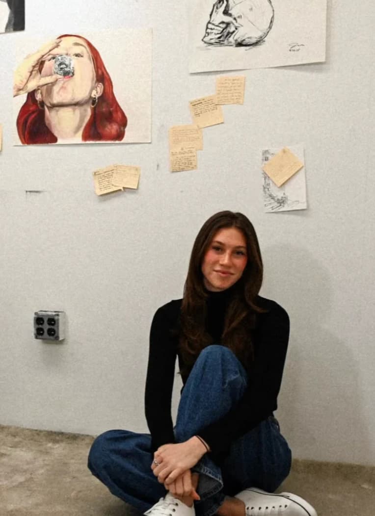Jaime Salmonson seated in an art gallery